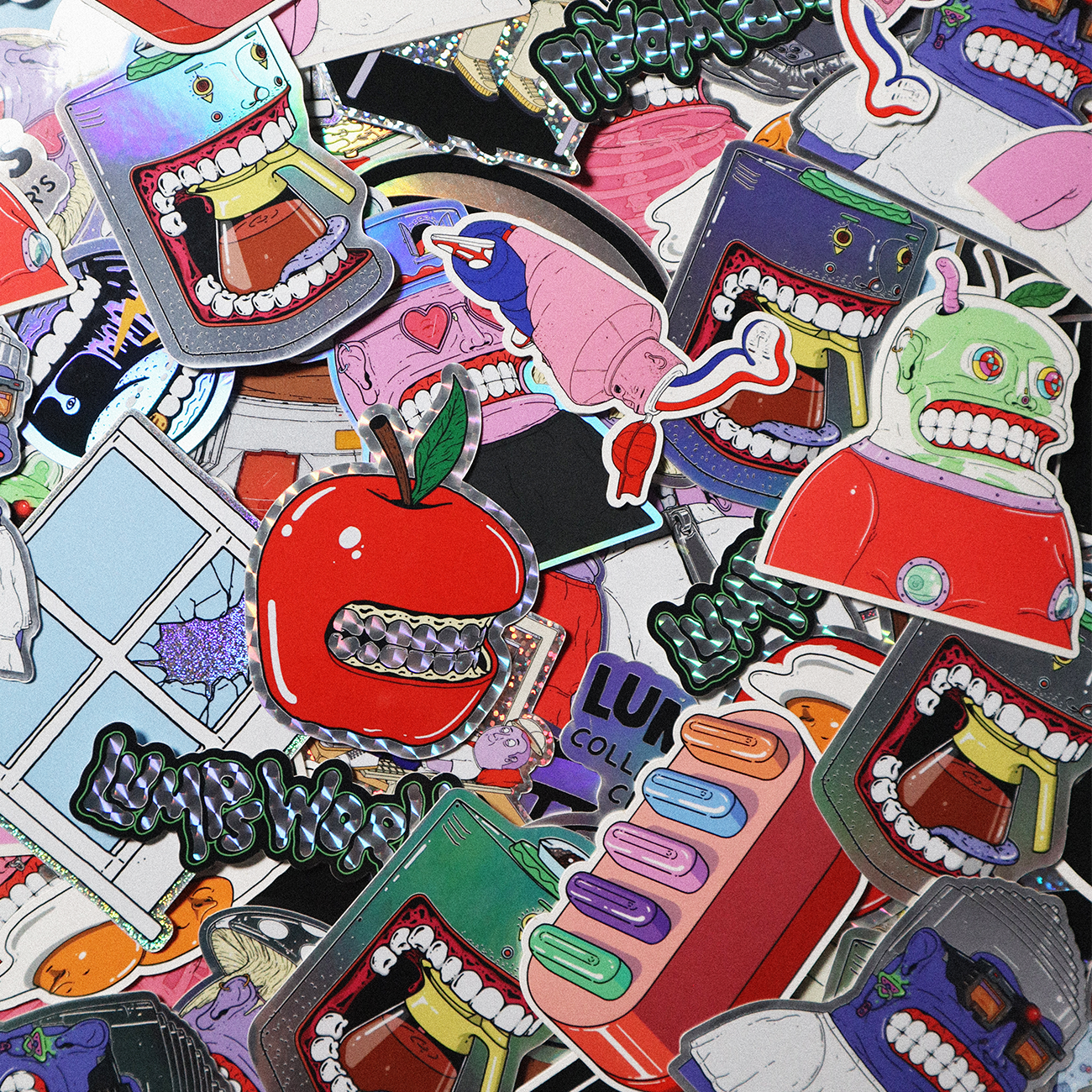 A colorful assortment of die cut stickers with cartoonish designs and bold outlines.