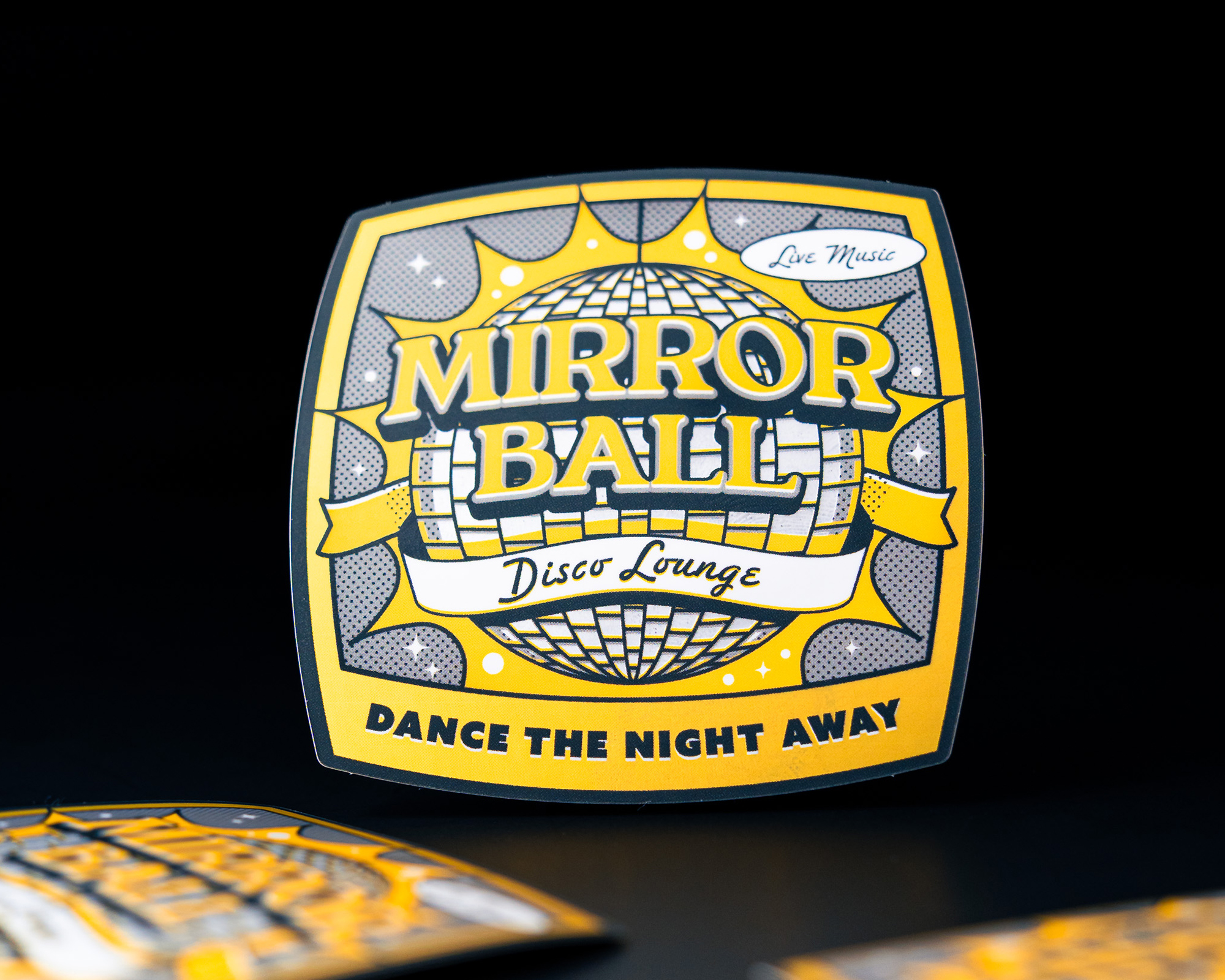 Yellow and black "Mirror Ball Disco Lounge" sticker with a disco ball design and "Dance the Night Away" text on a dark background.