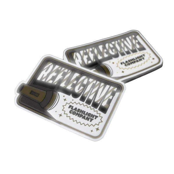 Reflektierende Aufkleber mit Taschenlampen-Design, fettem Schriftzug und dem Label „Flashlight Company“.